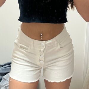 Super flattering and cute buttoned white denim shorts
